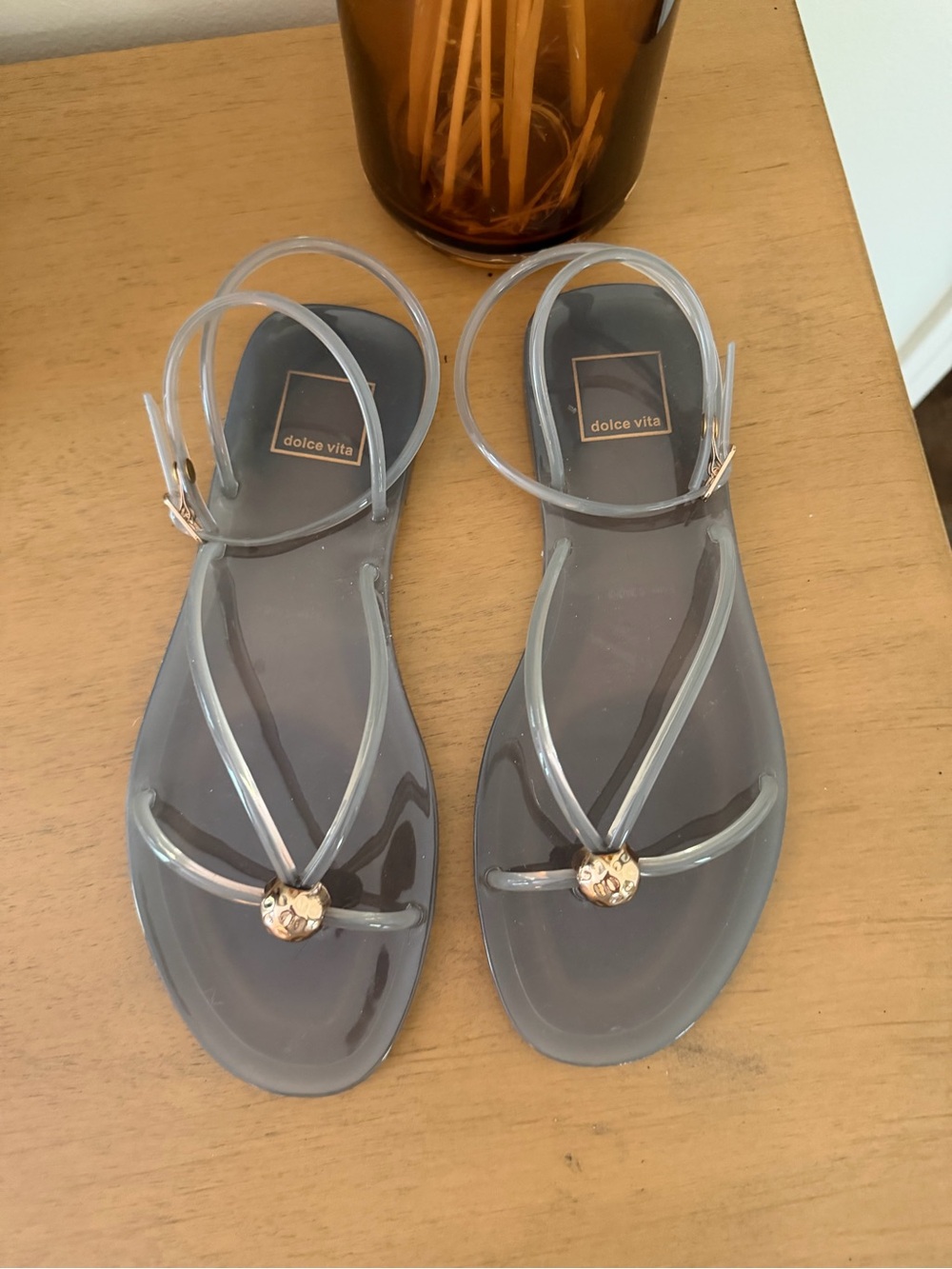 Dolce Vita Clear Gray Jelly Sandals with Gold Medallion